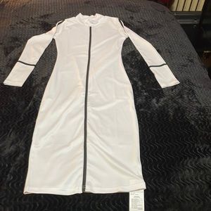 New…..White fitted dress with Black trim 95% polyester 5% spandex.